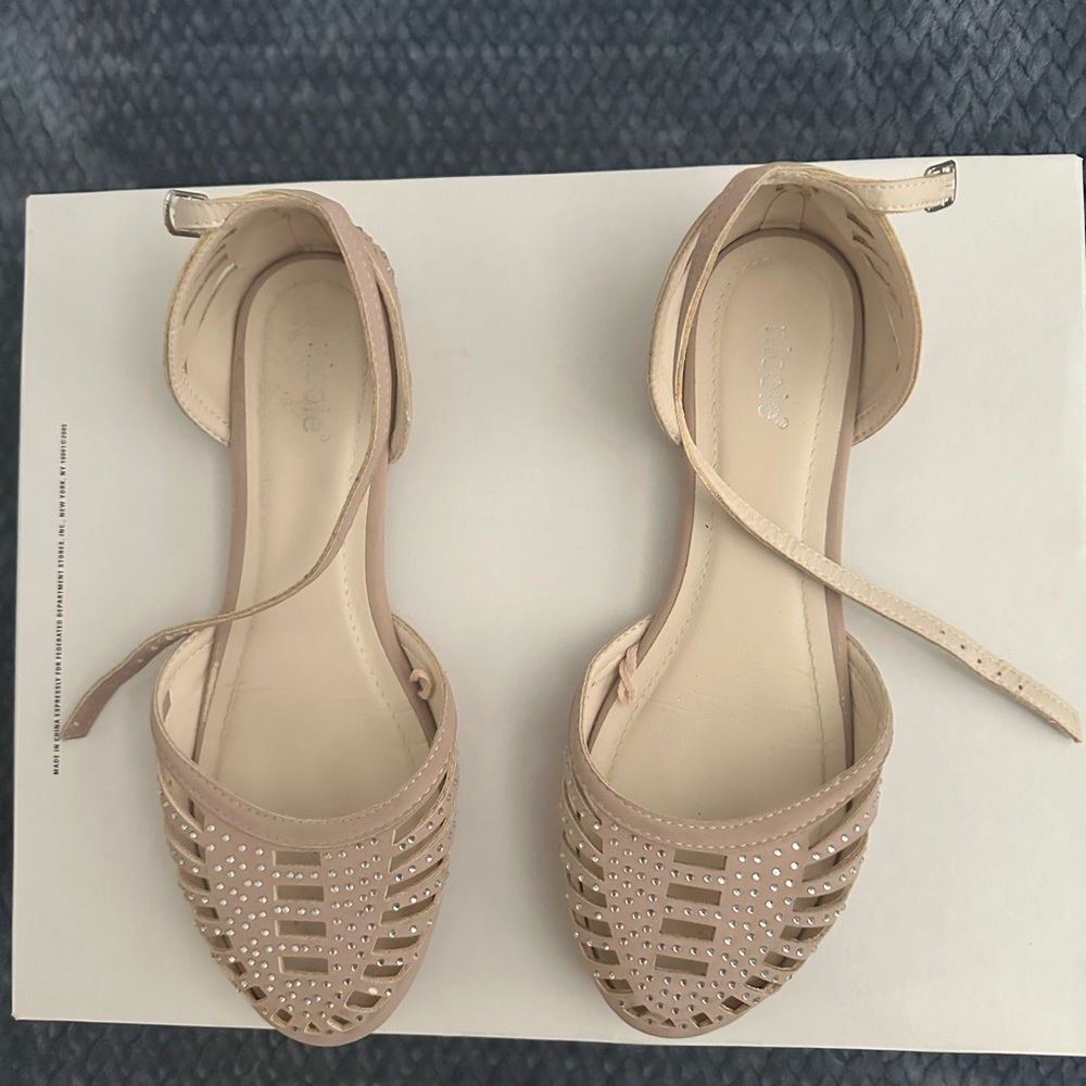 Flat ballerina style shoes. Rhinestones on top with ankle strap